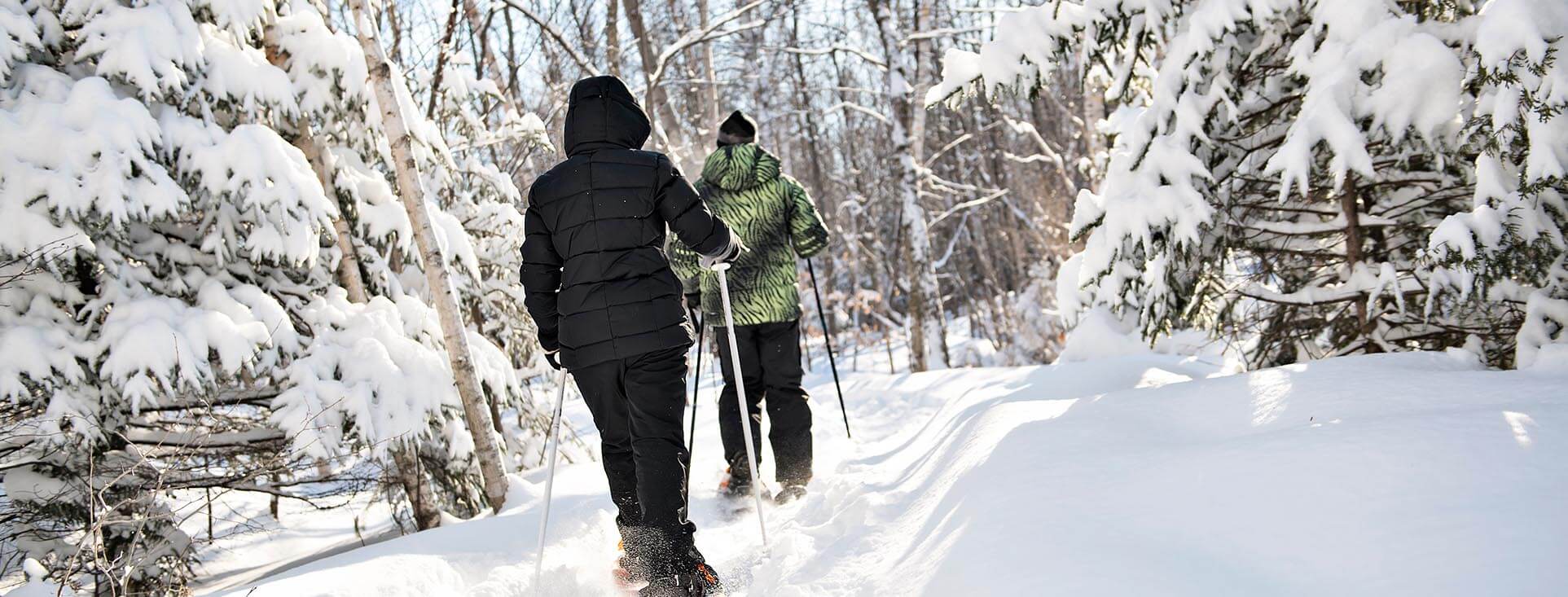 two people snowshoeing in winter.