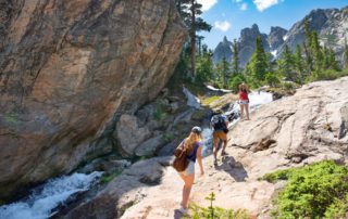 A family hiking in Estes Park during the summer