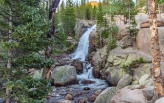 The view of a waterfall in Rocky Mountain National Park