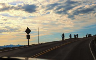 Cyclists biking on Trail Ridge Road in Rocky Mountain National Park during the summer