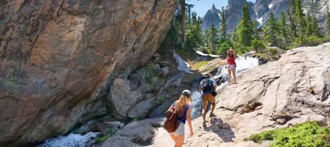 A family hiking in Estes Park during the summer