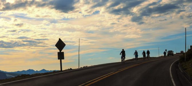 Cyclists biking on Trail Ridge Road in Rocky Mountain National Park during the summer