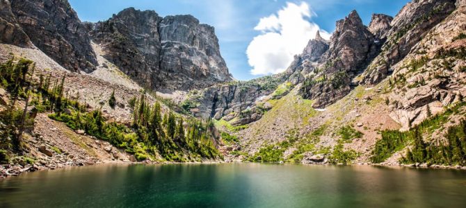 A hike to a lake with a mountain backdrop in Rocky Mountain National Park on a summer bucket list